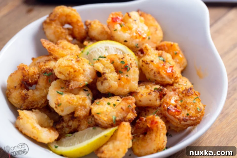 Platter of Classic Shrimp Scampi Fritta with lemon wedges and parsley
