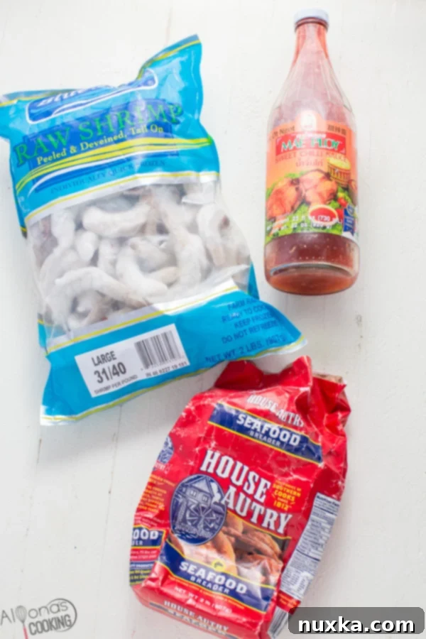 Ingredients laid out for Shrimp Scampi Fritta: raw shrimp, breading, and sweet chili sauce