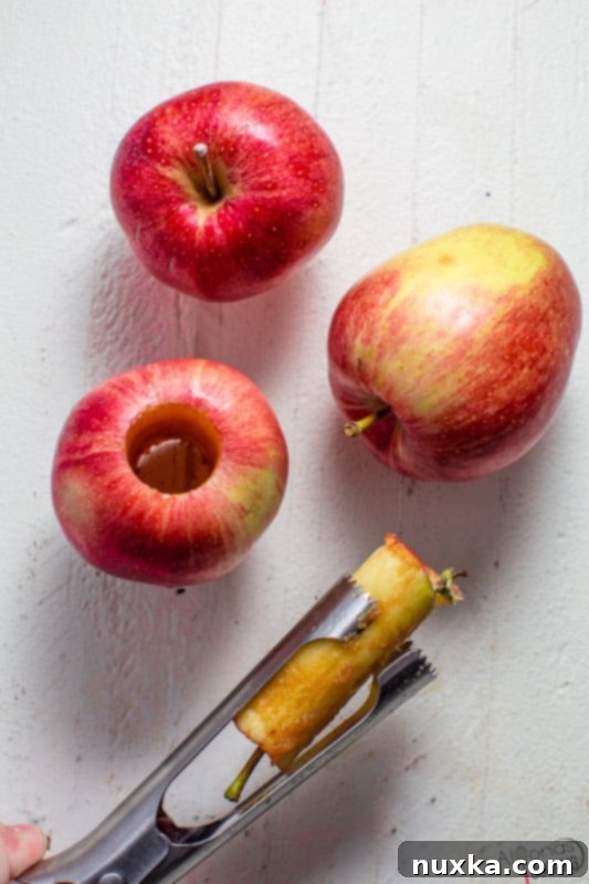 Step-by-step image demonstrating how to use an apple corer