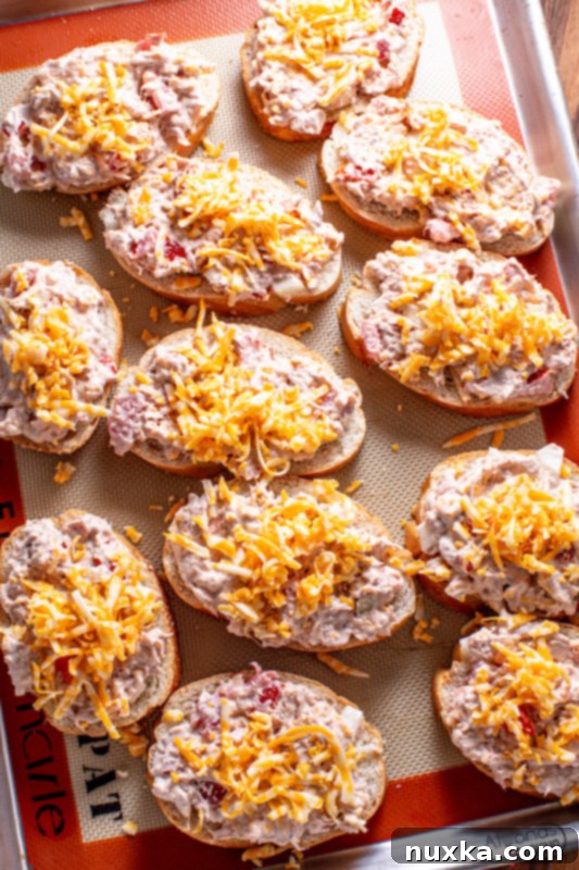 Freshly baked easy tuna melts on a baking sheet, ready to serve