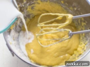 Step 1: Beating eggs and flour to form a thick paste.
