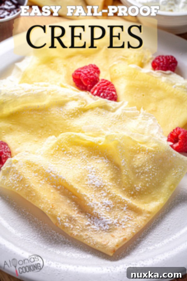 A beautifully presented, filled crepe on a plate, garnished with fresh berries and powdered sugar, highlighting its delicate texture.