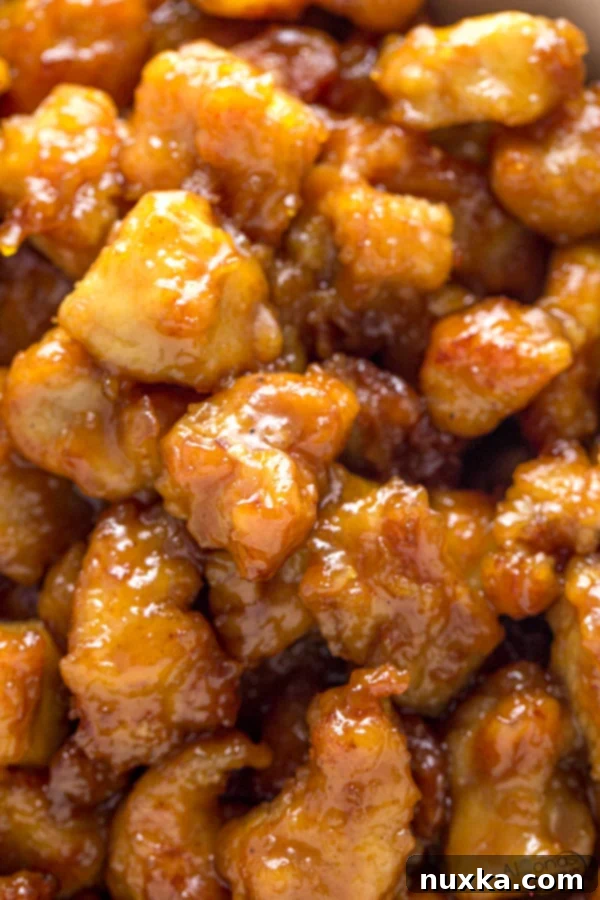 Crispy homemade orange chicken served with a flavorful sauce
