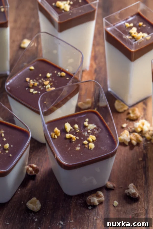 Birds Milk Dessert Parfaits topped with chocolate ganache and mint
