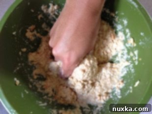 Ritz crackers soaking in milk for Kotleti recipe