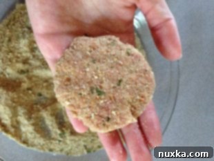 Forming Kotleti patties and coating in breadcrumbs