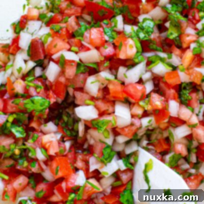 Restaurant Style Chipotle Pico De Gallo 2 Fresh homemade Pico de Gallo served in an elegant glass bowl, ready to enjoy.