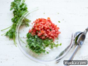 Step-by-step image showing diced tomatoes, onion, and jalapeño ready to be mixed for pico de gallo.