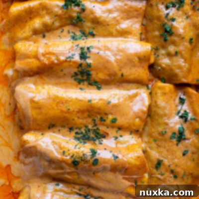 Beef enchiladas bathed in a luscious homemade enchilada sauce.