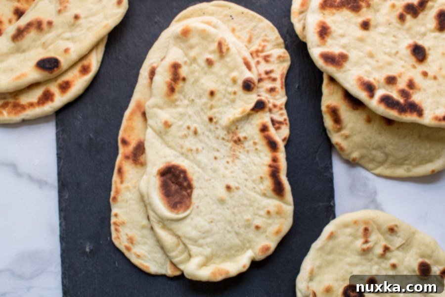 homemade naan bread dough after rising, fluffy flatbread preparation