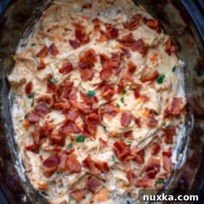 Slow Cooker Chicken Bacon Ranch mixture in a bowl, ready to be served