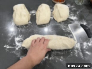 Shaping French bread dough into loaves