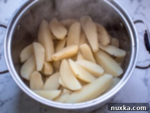 Step 1: Parboiling potato wedges in water