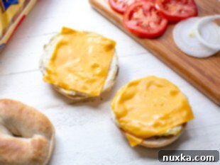 eggs with American cheese on plain bagels for breakfast sandwiches