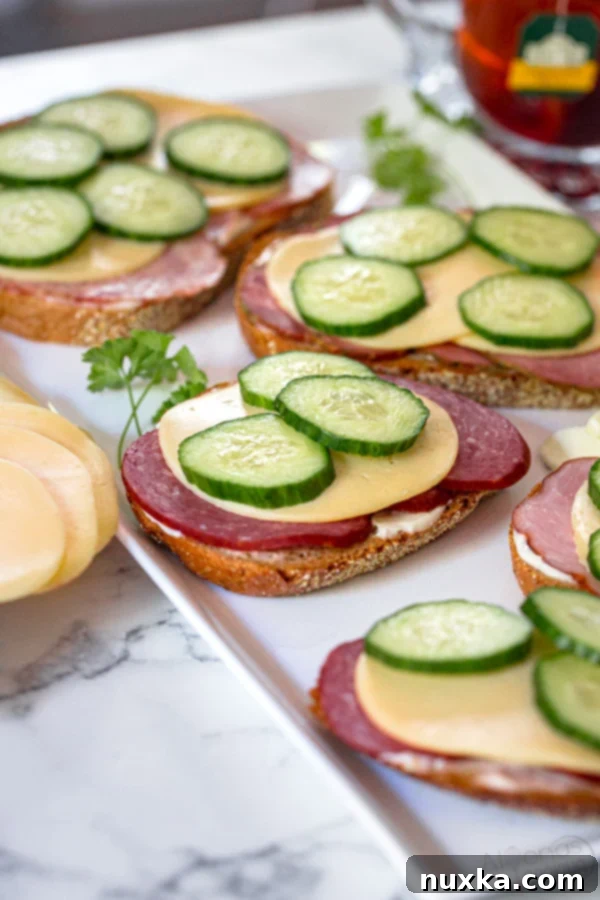 Russian tea sandwiches with kielbasa, cheese and cucumbers on Lithuanian bread