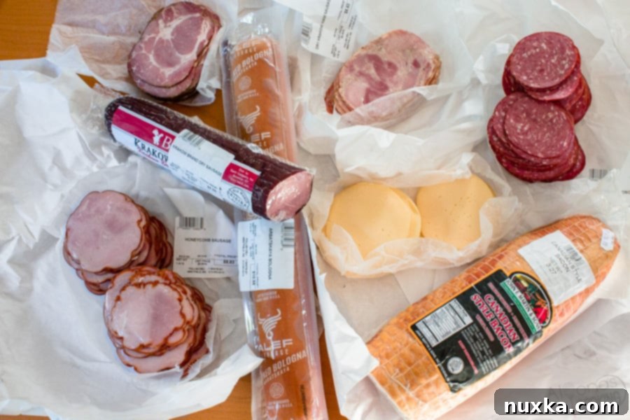 different kinds of Kielbasa and cheese for Russian Tea Sandwiches 