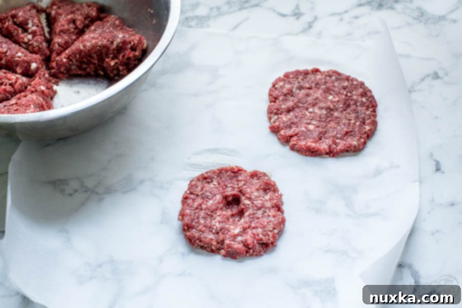 how to make thick burger patties, showing a thicker patty with a dimple