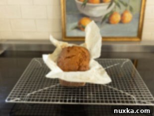 baked banana bread on a cooling rack to cool completely