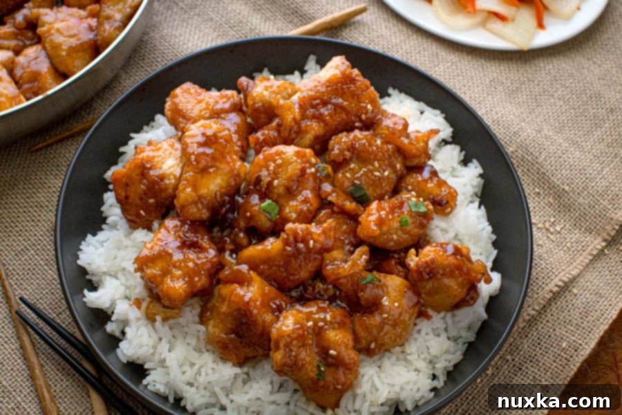 General Tsos Chicken recipe on a plate over white rice