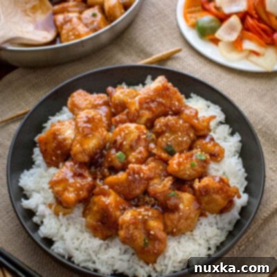 General Tso Chicken recipe on a plate over white rice
