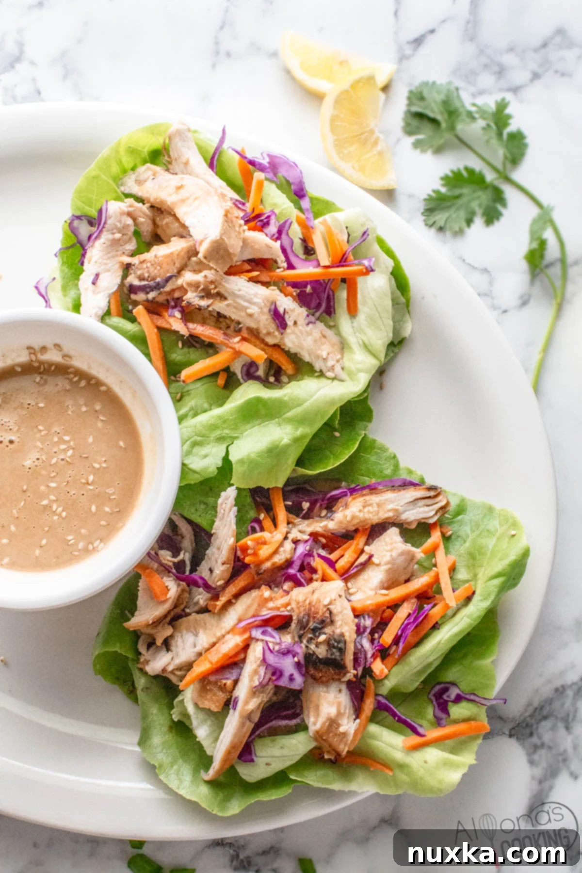 Healthy chicken lettuce wraps ready to be served on a white platter