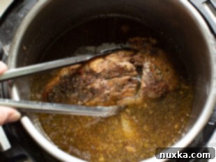 removing the tender beef from the instant pot