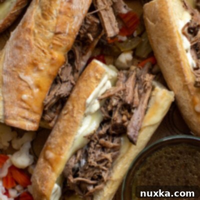 Ultimate French Dip Sandwich 2 French dip sandwich in a crusty baguette roll with mustard sauce and melted Havarti cheese