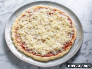 topping pizza on pan