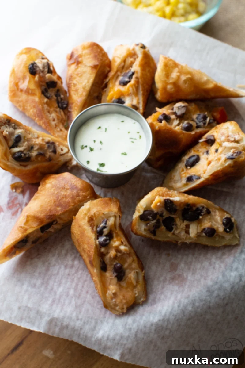 southwestern egg rolls recipe cut and served with ranch