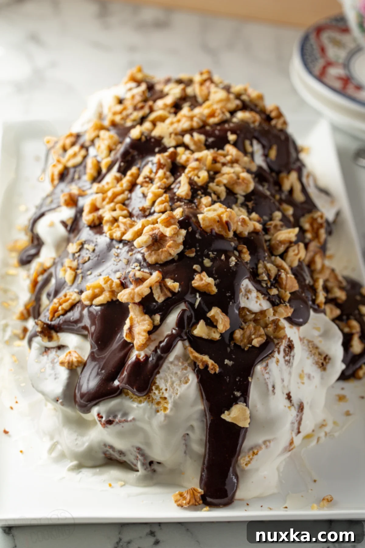 Delicious slice of Russian Curly Boy Cake with cream and ganache