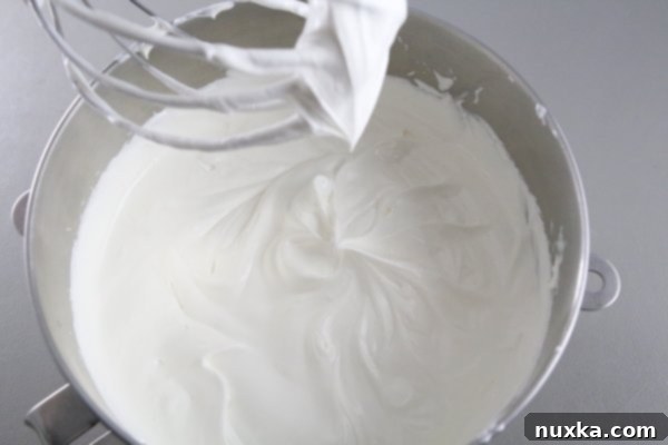 Preparing the luscious cream for Curly Boy Cake
