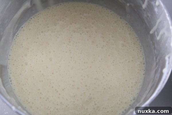 Divided cake batter for vanilla and chocolate layers of Curly Boy Cake