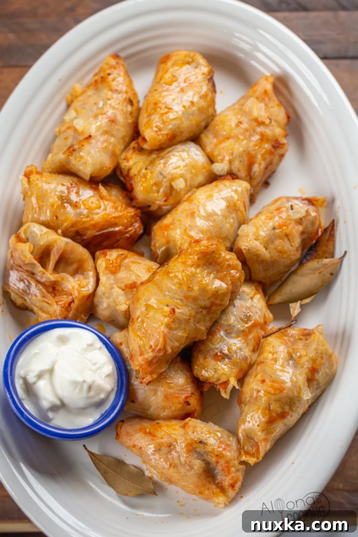 Delicious Moldovan Cabbage Rolls (Sarmale) baked to perfection, showcasing the golden-brown sauce and tender cabbage leaves.