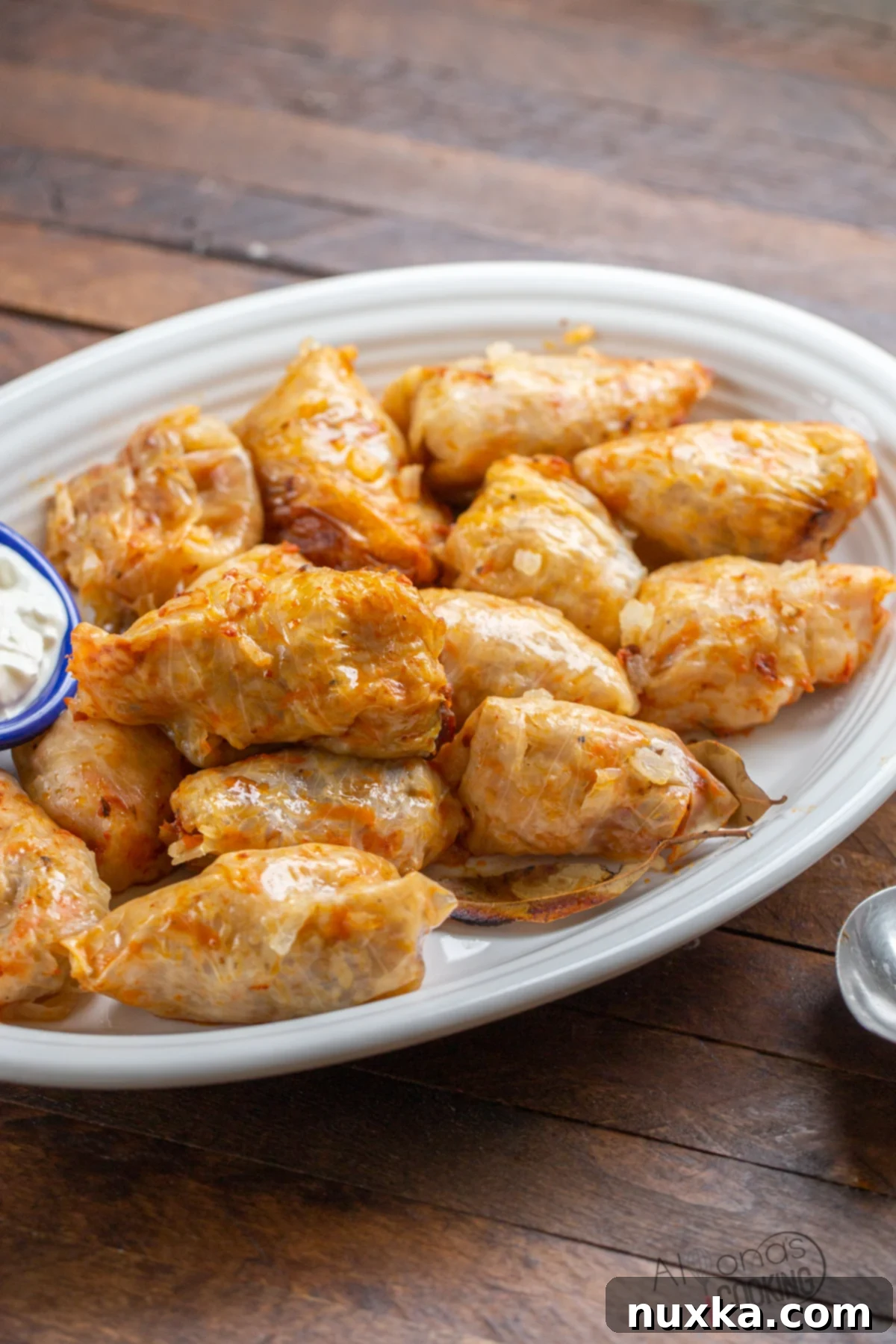 Moldovan Cabbage rolls recipe (Sarmale) on a rustic wooden board, ready to be served.