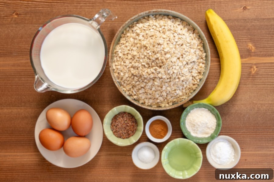banana oat waffles ingredients (rolled oats, milk, baking powder, salt, cinnamon, flax seeds, coconut oil, coconut flour, ripe banana, and eggs)