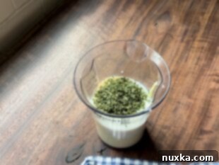 kefir ranch dressing ingredients in a measuring cup