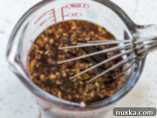 Whisking ingredients for homemade teriyaki sauce