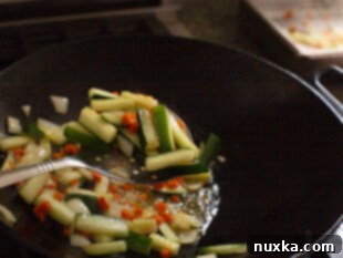 Sautéing vegetables in a hot wok
