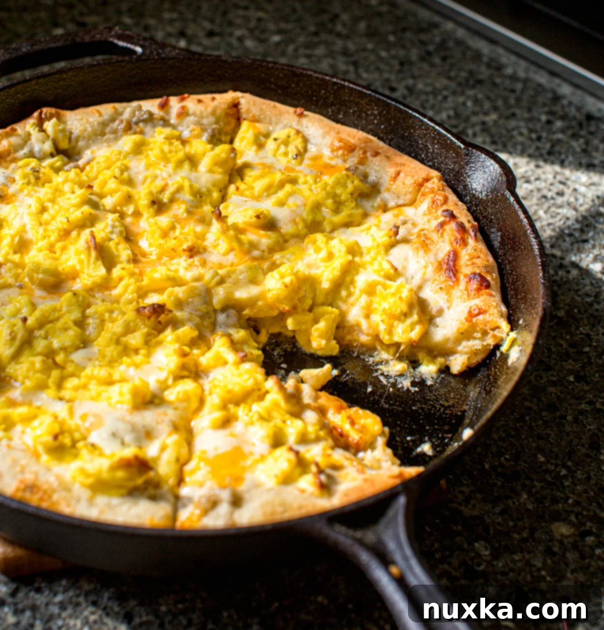 Homemade breakfast pizza baked in a cast-iron skillet