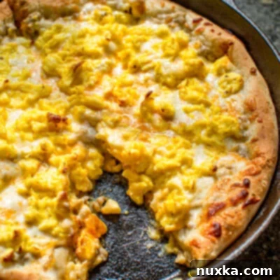 Savory Sausage Gravy Breakfast Pizza 2 Breakfast pizza recipe with sausage gravy and a homemade pizza dough crust