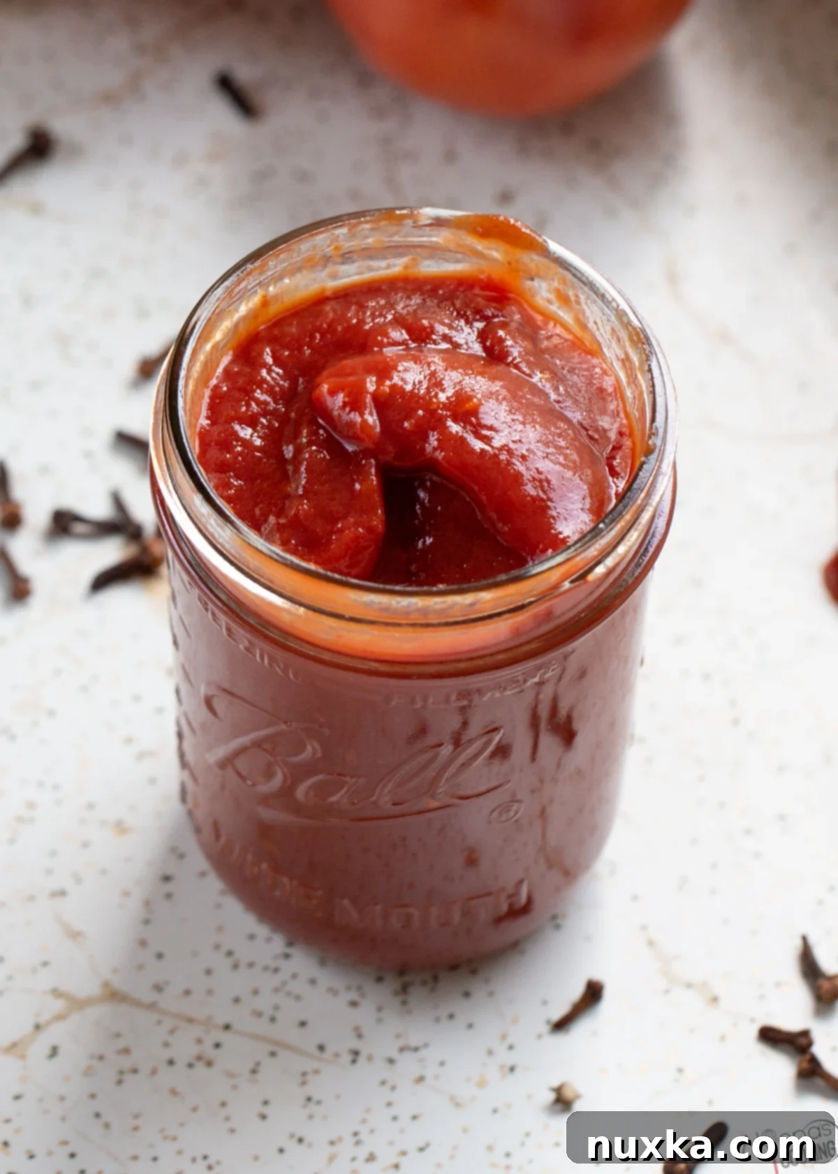 This Canned Ketchup Recipe tastes like Heinz ketchup! Homemade ketchup is made from ripe tomatoes, spices, and vinegar. Achieve that perfectly tart and sweet ketchup that is not runny! It gets highly raved and is surprisingly easy! I share all the tips and secrets on how to make creamy ketchup at home easily! Now you can make unlimited ketchup to dip with french fries or squirt over hamburger buns! #ketchup #recipe #Heinz #canned #tomato #sauce #homemade how to make ketchup that tastes like Heinz Ketchup