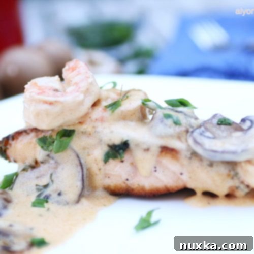 A vibrant platter of Salmon, Shrimp, and Mushroom Alfredo, ready to serve
