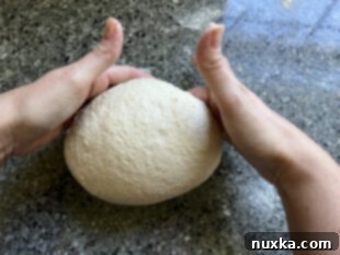 shaping the dough into a tight ball