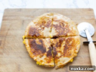 breakfast quesadilla cut into wedges