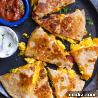 healthy breakfast quesadillas using whole wheat flour tortillas, bacon with no nitrates, free-range eggs, and freshly grated cheese served with homemade salsa and Crema