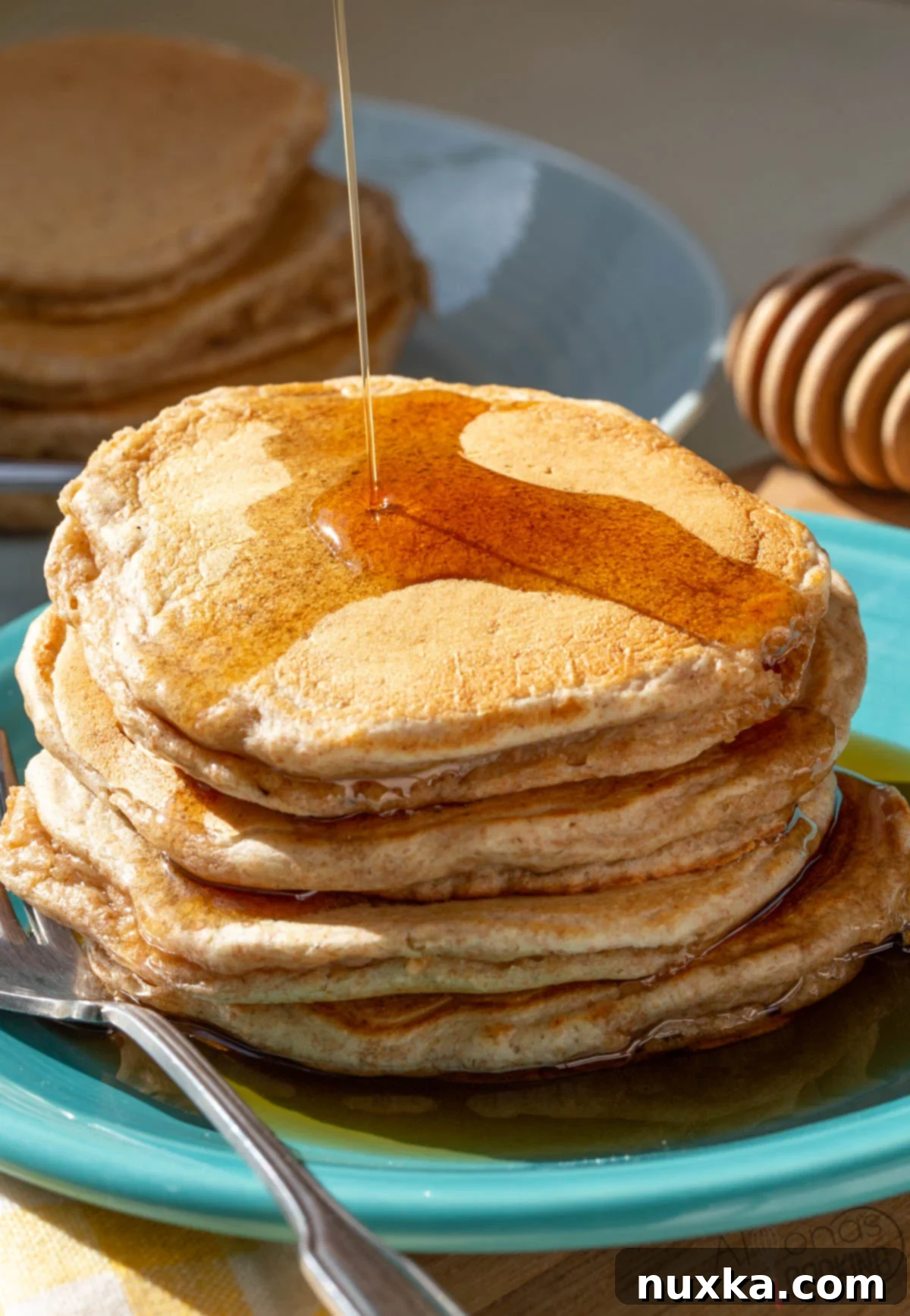 stacked whole wheat pancakes on a plate