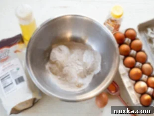ingredients for healthy pancakes: egg, whole wheat flour, milk, honey, oil, salt, and baking powder