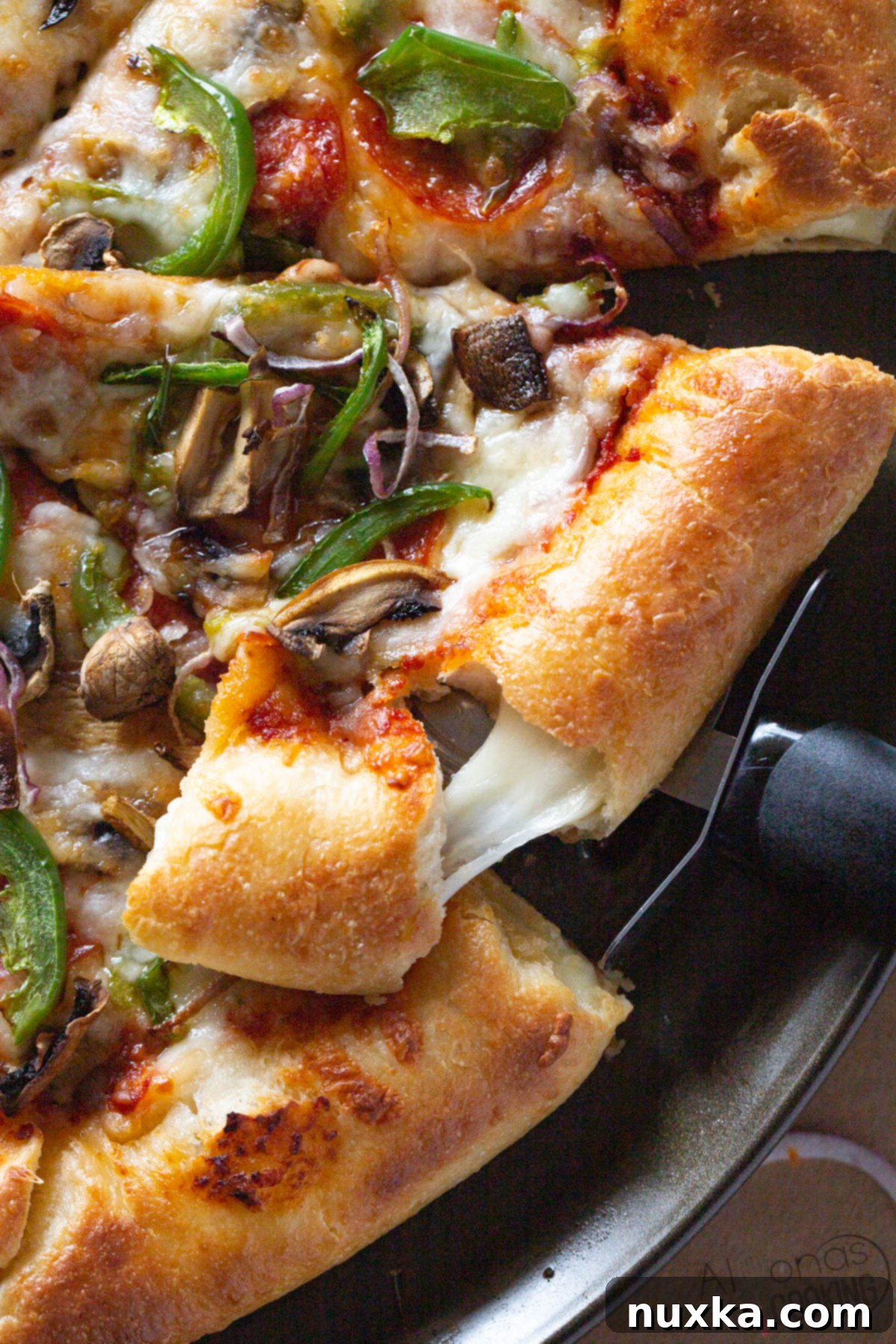 Up-close shot of a cheesy Pizza Hut stuffed crust