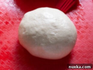 pizza dough for stuffed crust pizza being prepared