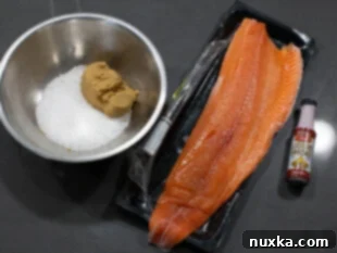 ingredients for smoked salmon (lox recipe); fresh 3-pound salmon fillet, Hickory liquid smoke, brown sugar, sea salt, and oil